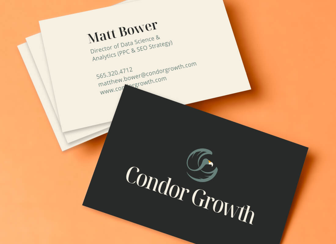 Two business cards with Condor Growth’s logo on an orange background. One shows name and information, the other displays their logo on black.