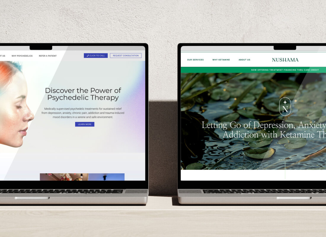 Two laptops on a light wooden table displaying two different websites created for Nushama.