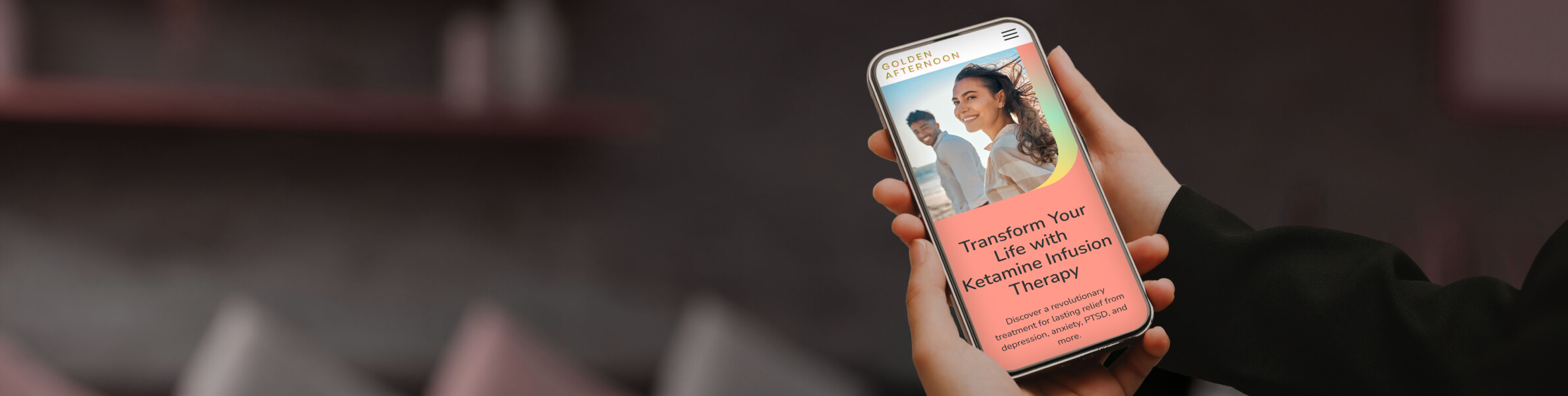 A person holds a smartphone displaying a webpage about a business's website, set against a dark, modern background.